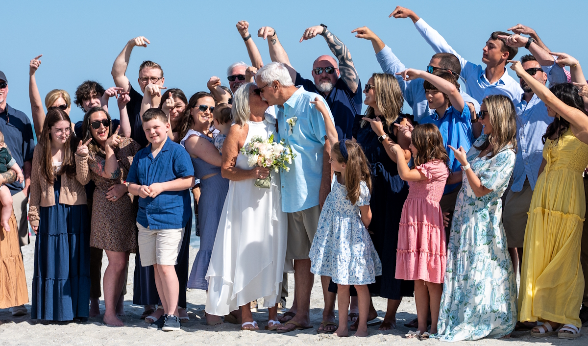 Here is Photographers at the Beach offering Affordable Family Photographers Myrtle Beach at an April 2026 beach wedding. After the ceremony all family groups are welcome to jump in for included family portraits. WOW and starting at only $199!